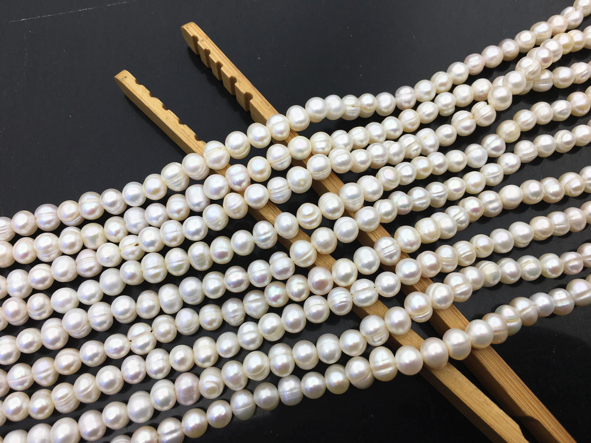 AA 5.7-6.5mm white Ring potato freshwater pearl, near round white pearl bead strand supply from China, wholesale in bulk, CR6-2A-2