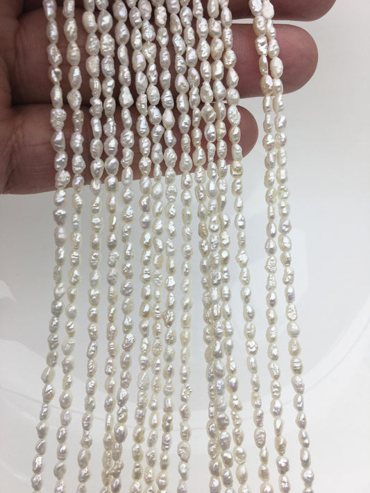 White Keshi Freshwater Pearl Strand — 3 × 4–5.5 mm