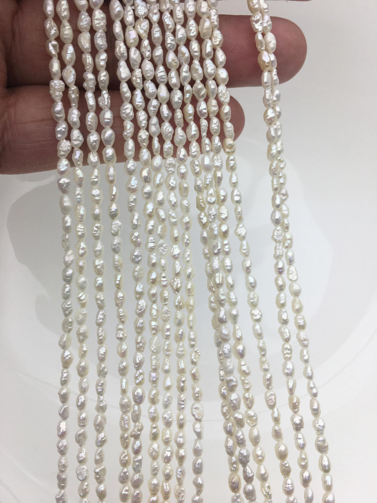 White Keshi Freshwater Pearl Strand — 3 × 4–5.5 mm