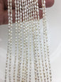 White Keshi Freshwater Pearl Strand — 3 × 4–5.5 mm