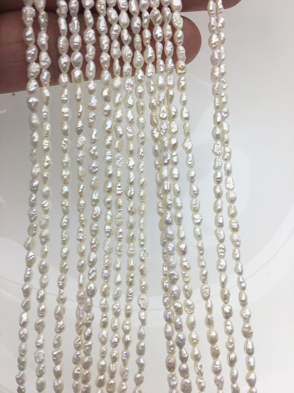 White Keshi Freshwater Pearl Strand — 3 × 4–5.5 mm