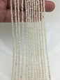 White Button Freshwater Pearl Strand — 2.5–3 mm